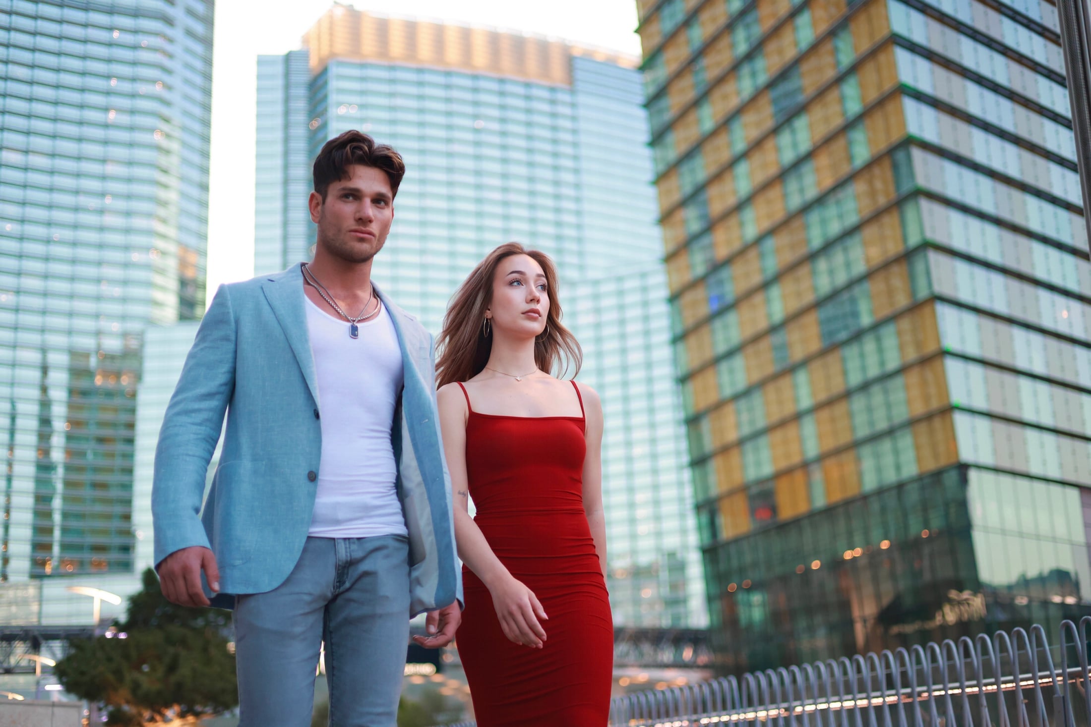 Couple walking between high-rise towers
